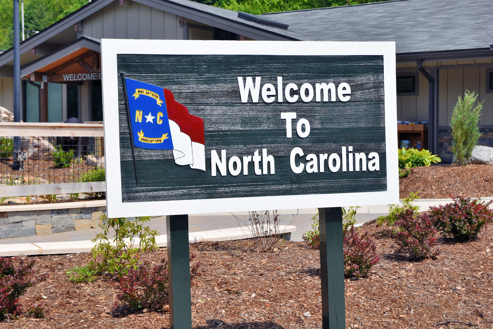 Charlotte, North Carolina's real estate is booming-- and investors still have a chance to enter the market. Charlotte offers many excellent amenities, and is centrally situated in North Carolina. This sign in Clyde, N.C. taken inJune 2020 welcomes those e